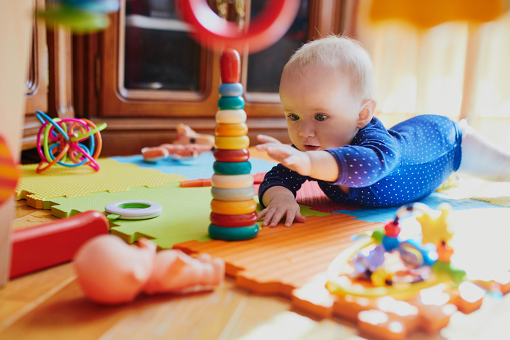 babies playing with tactile toys