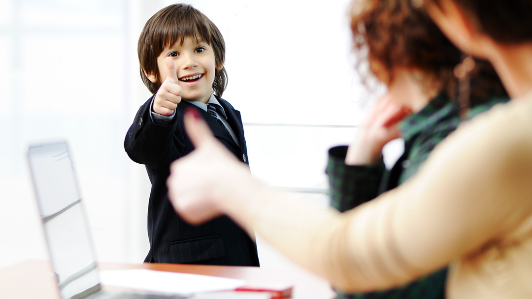 boy giving his teacher a thumbs up