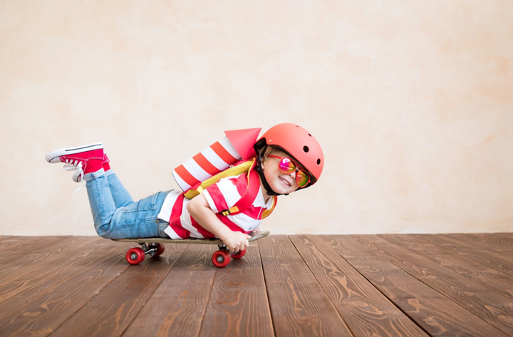 boy on a skateboard with a rocket on his back