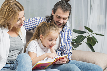 Family reading together to support early reading preschool Pembroke Pines - Learning Village Early Reading