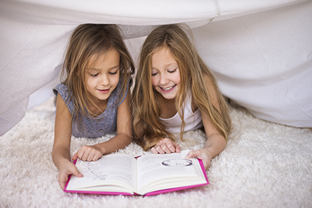 Children enjoying reading together supporting early reading preschool Pembroke Pines - Learning Village Early Reading